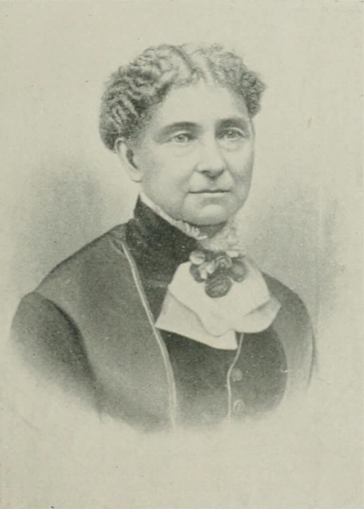 Engraved portrait of Amelia Bloomer with a bow at her collar.