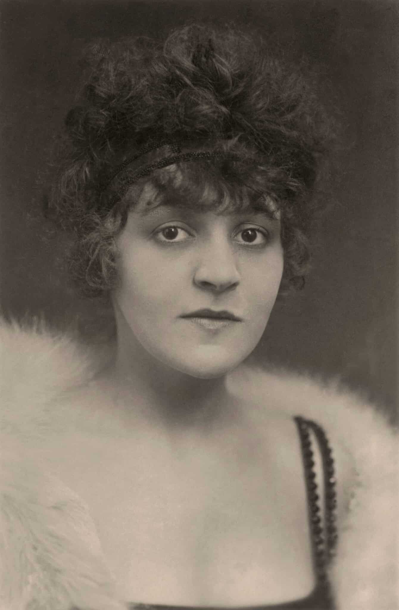Anita Berber facing the camera, with short curly hair.