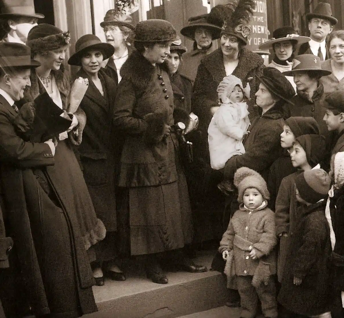 Margaret Sanger, Ethel Byrne and Fania Mindell stand amid a crowd on courthouse steps.