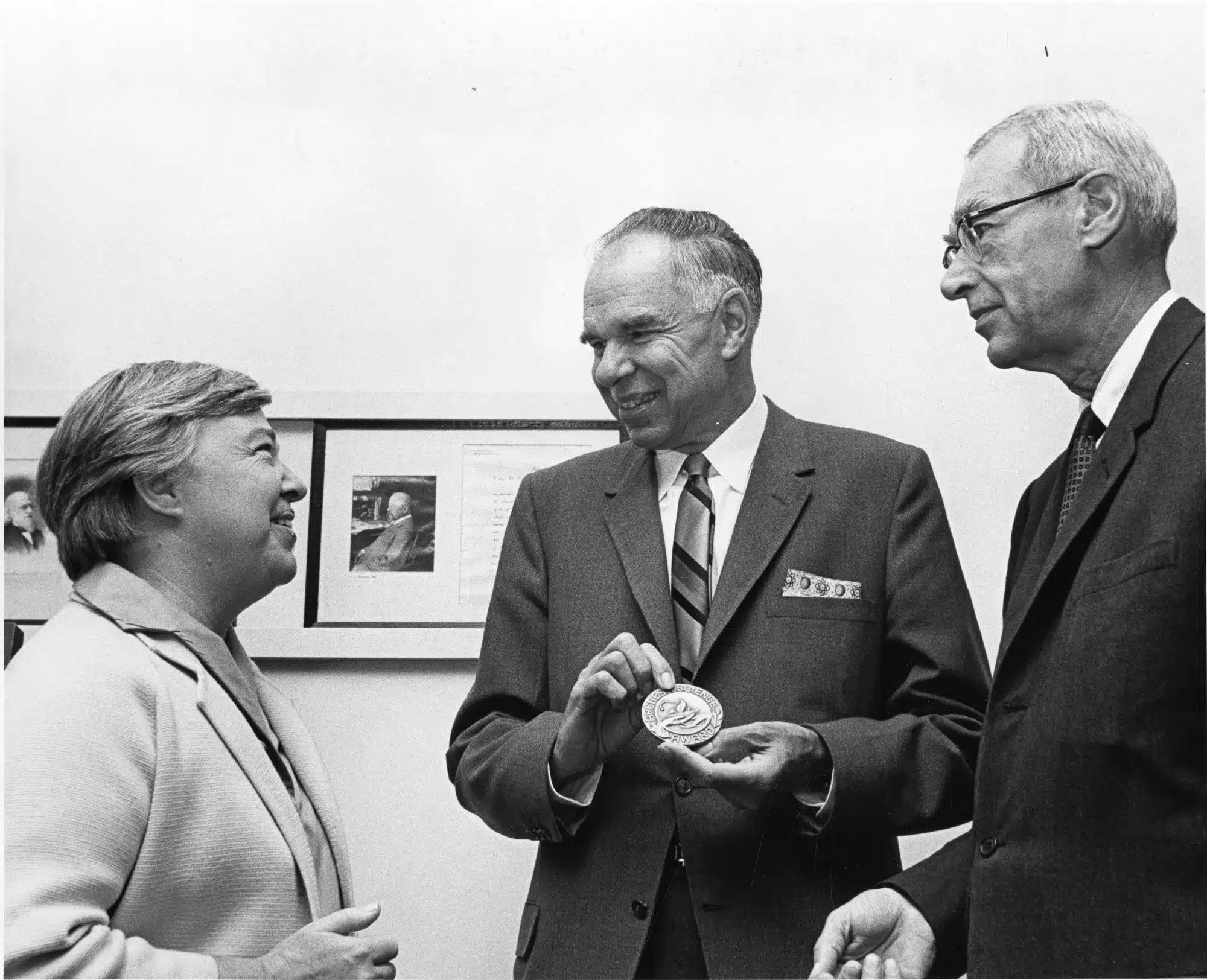 Dixy Lee Ray, Glenn Seaborg and Ed Westcott stand together at an event.