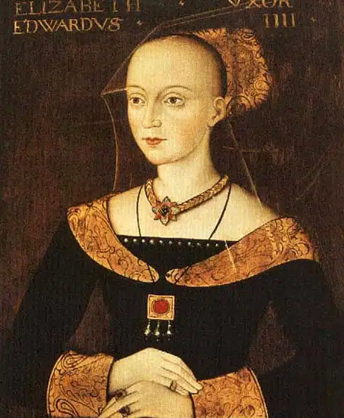 Painted portrait of Elizabeth Woodville with a headdress and her hands clasped.
