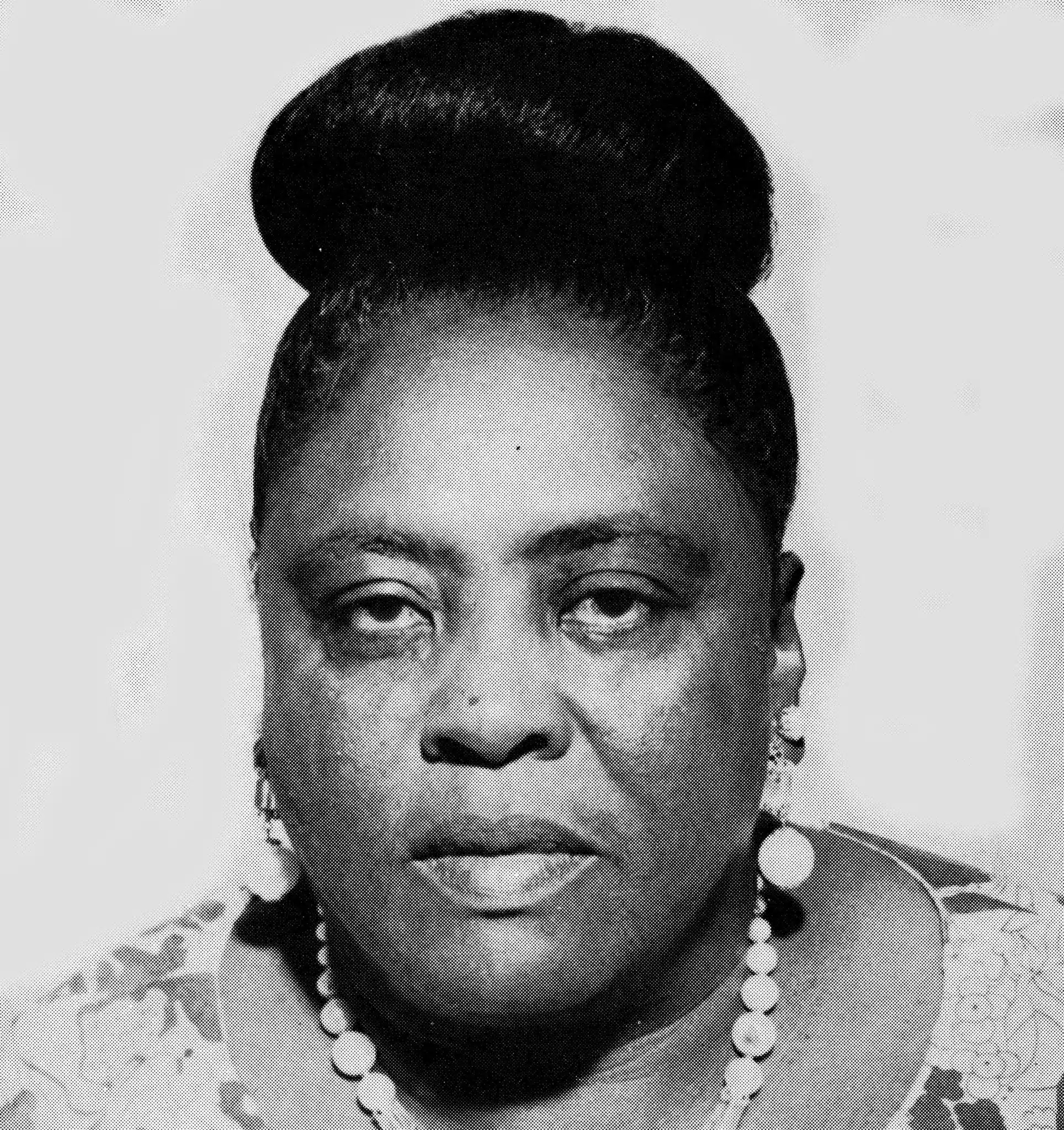 Fannie Lou Hamer facing the camera, wearing a necklace.