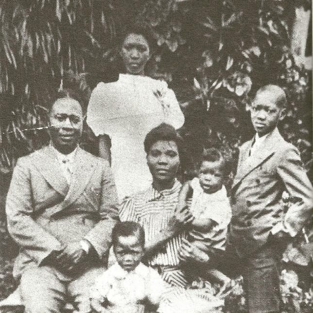 The Ransome-Kuti family in the 1940s | Amazing Women In History Funmilayo and Oludotun Ransome-Kuti seated with their four children, including a baby in her arms.