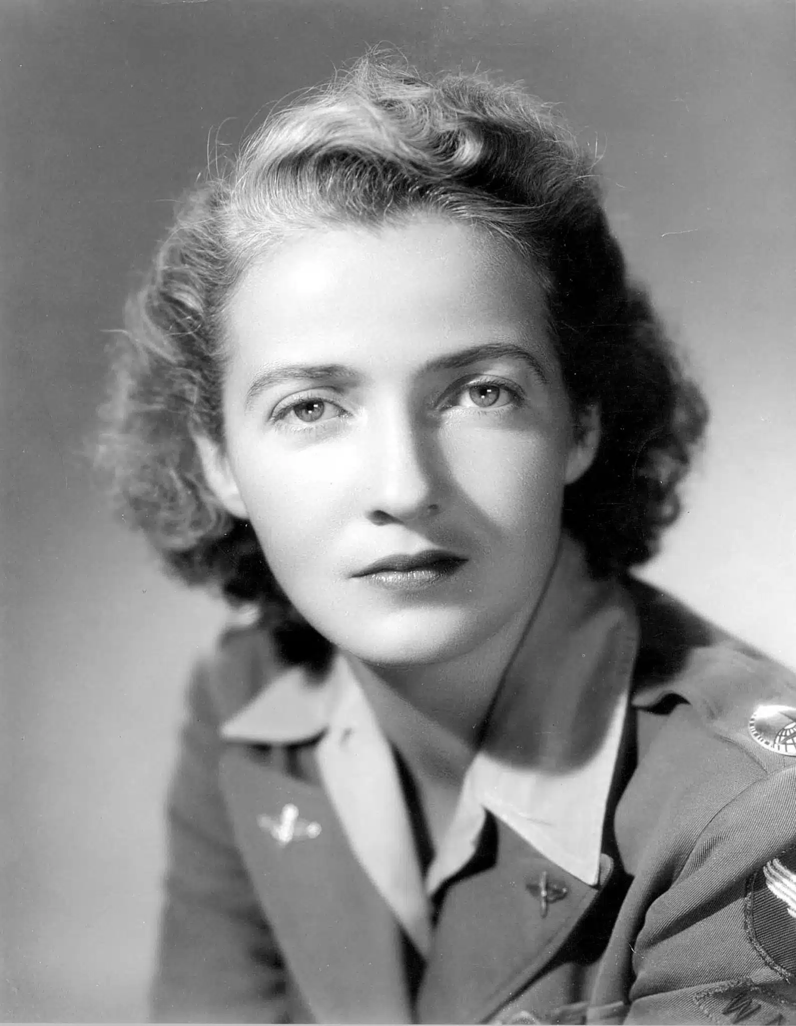 Nancy Harkness Love wearing an aviation uniform with insignia.