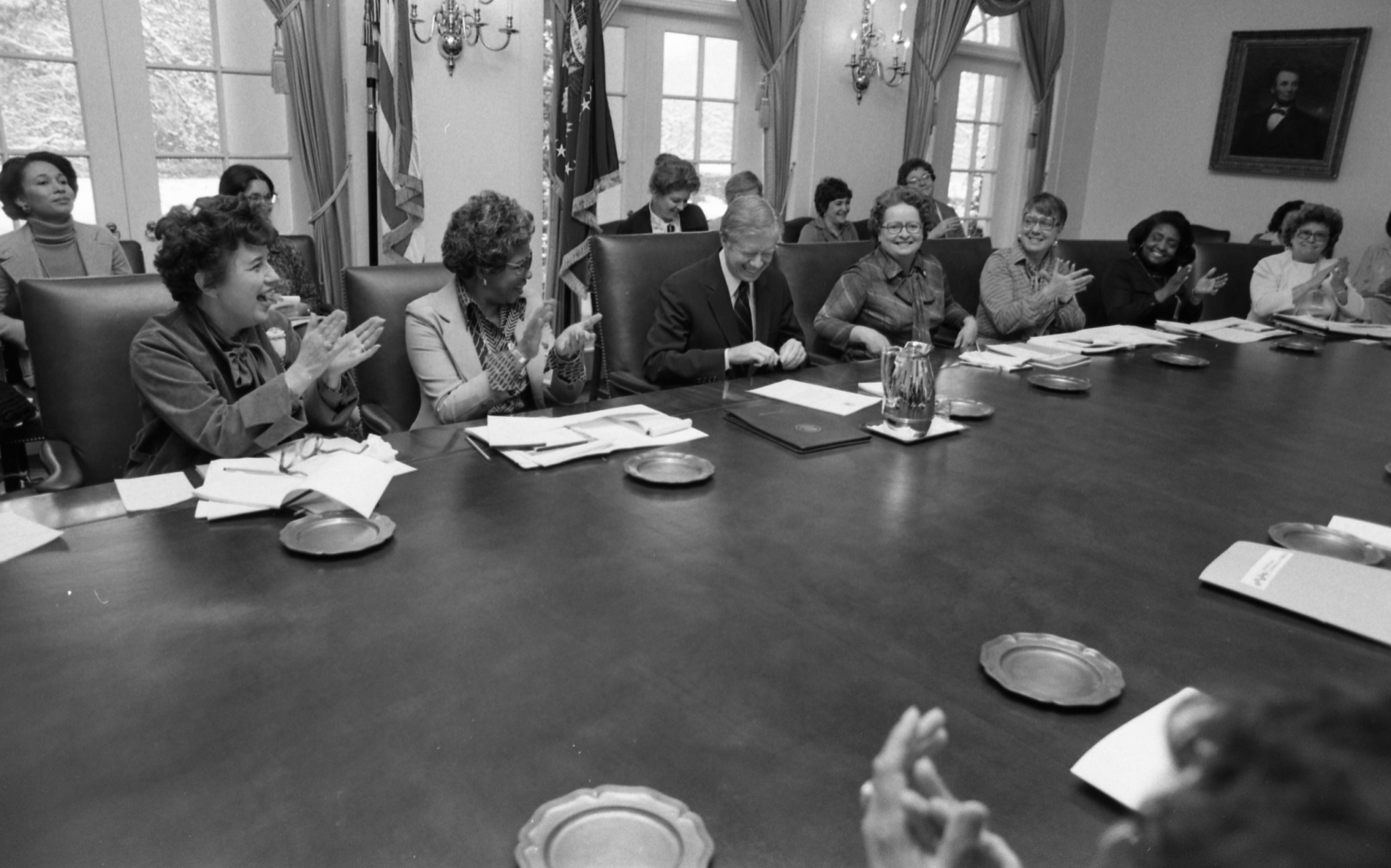 National Women’s History Week proclamation signing, February 1980 | Amazing Women In History Jimmy Carter sits at a conference table as women around him applaud the National Women’s History Week proclamation.